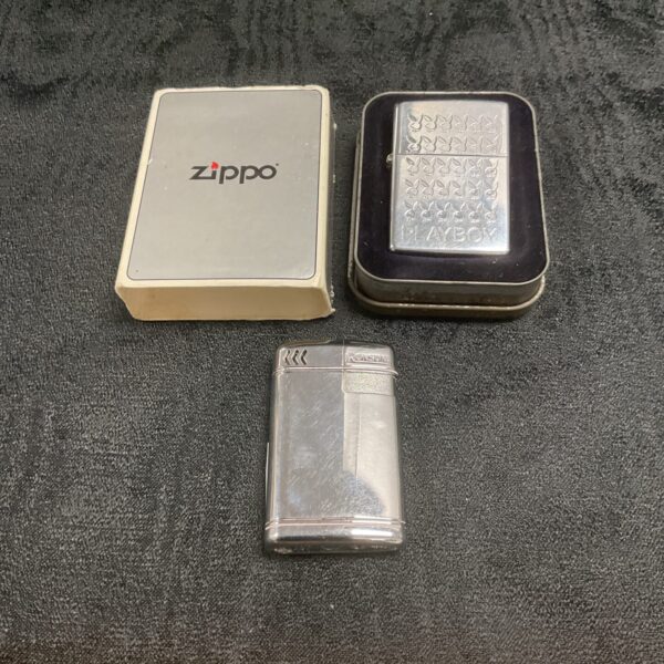 Zippo playboy lighter in tin and Ronson gas lighter