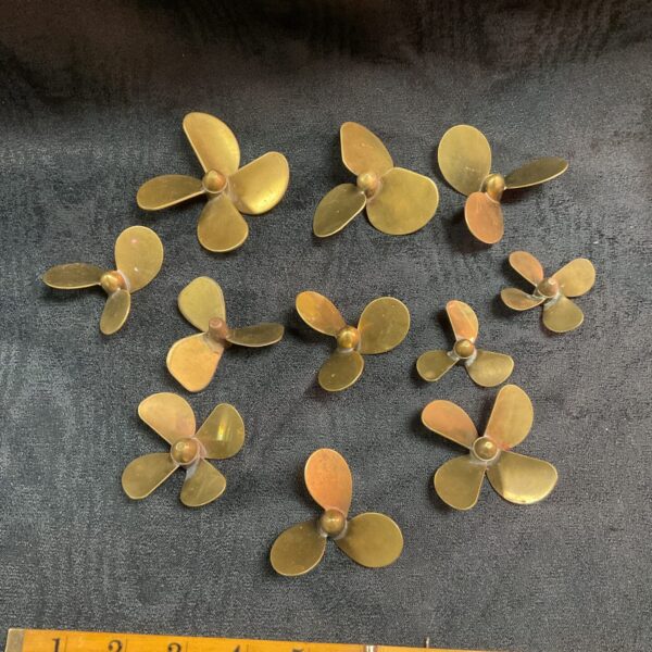 Lot of eleven vintage brass model boat propellers.