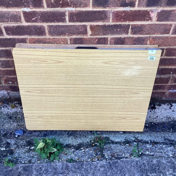 Vintage wooden folding pasting table for crafts and work.