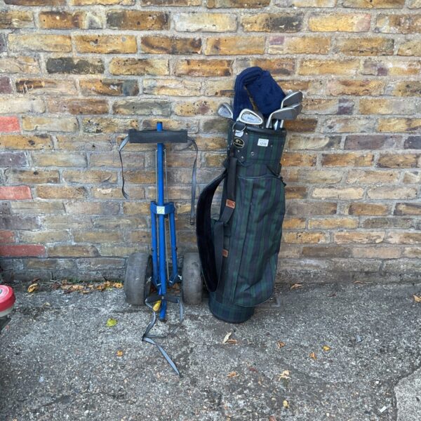 Vintage Mitsushiba golf bag with Mizuno clubs and Kingslaw trolley.