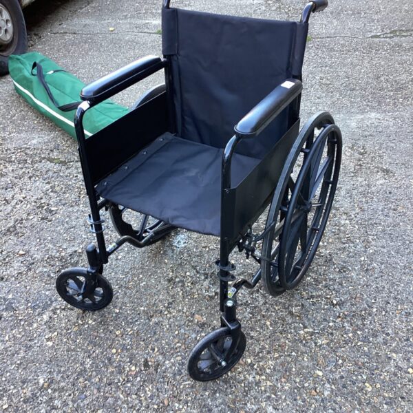 Black folding wheelchair presented in used condition.