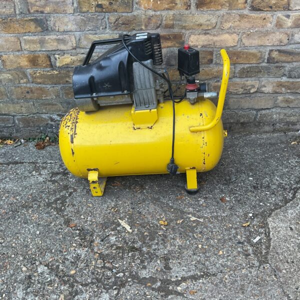 Yellow Cosmo midi air compressor for workshop use.