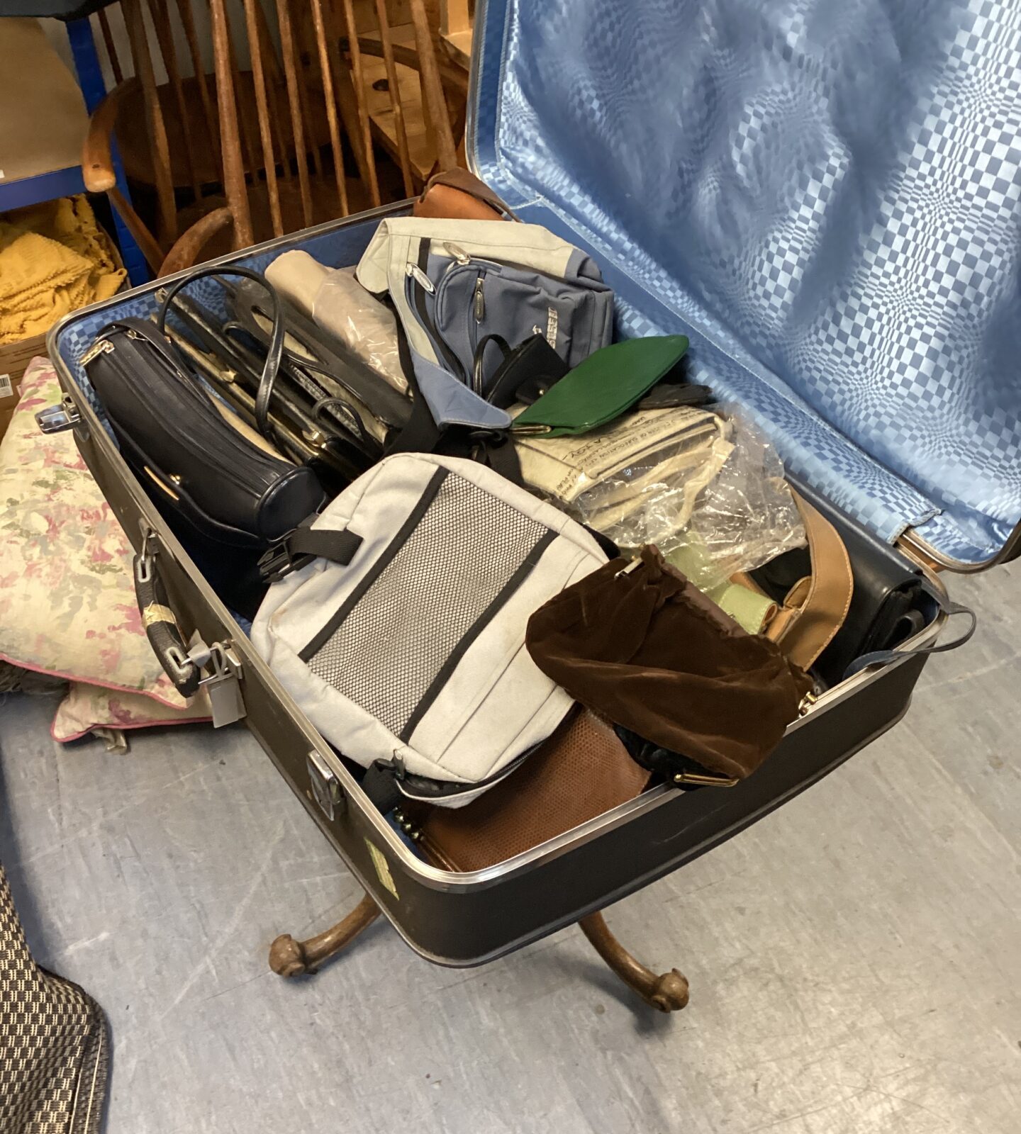 Antler suitcase full of bags