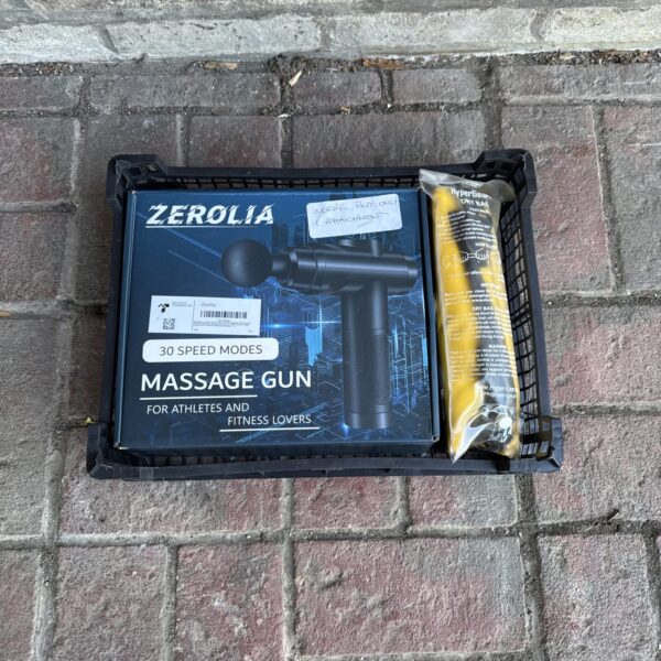 Zerolia massage gun with Hypergear diving dry bag for fitness recovery.