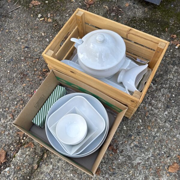 White kitchenware set with soup pot and serving trays.