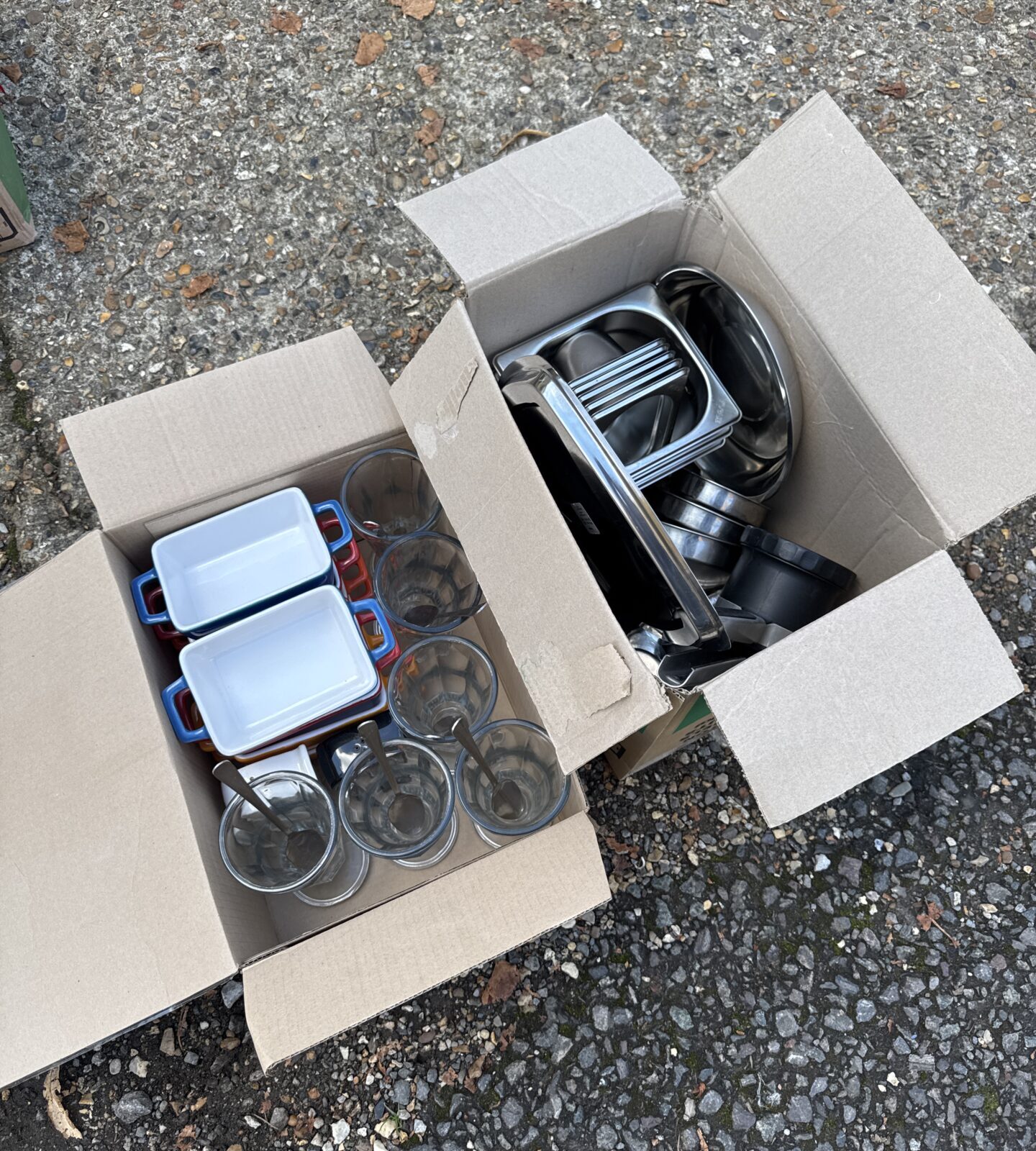 Two boxes of mixed kitchen items inc stainless steel, sundae glasses & small cooking trays
