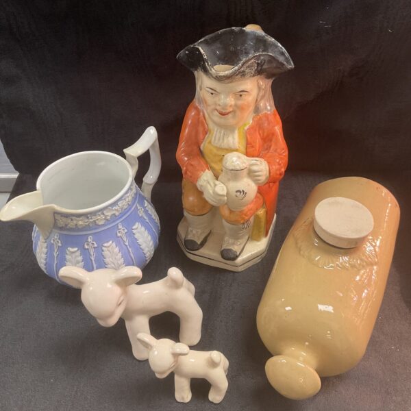 Vintage Toby Jug depicting a gentleman in colourful attire.