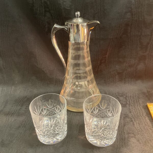 Vintage silverplate claret jug with two crystal glasses.