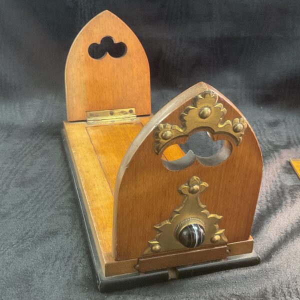 Antique Gothic bookslide with ornate brass and agate details.