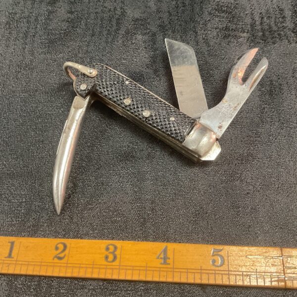 1942 dated British Army jack knife, showing wear and patina.