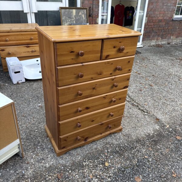 Vintage pine tallboy chest of drawers with five drawers.