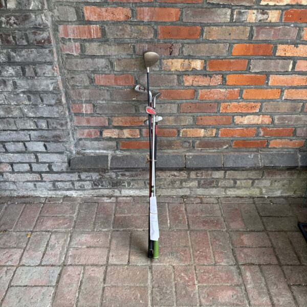 Mixed set of junior golf clubs including a putter and wood.