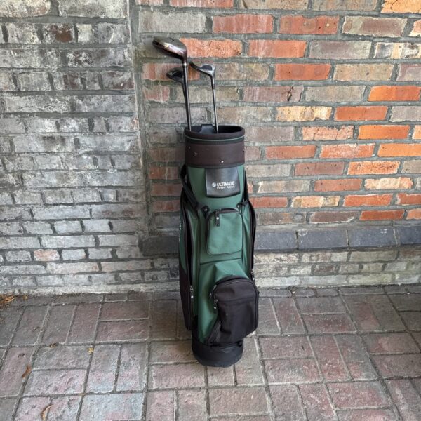 Vintage Peter Alliss golf bag with Wilson woods for collectors.