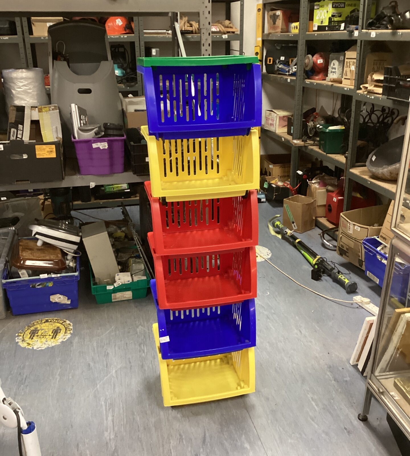 Bundle of plastic stacking storage baskets