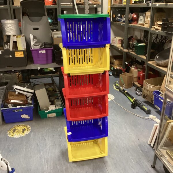 Bundle of plastic stacking storage baskets