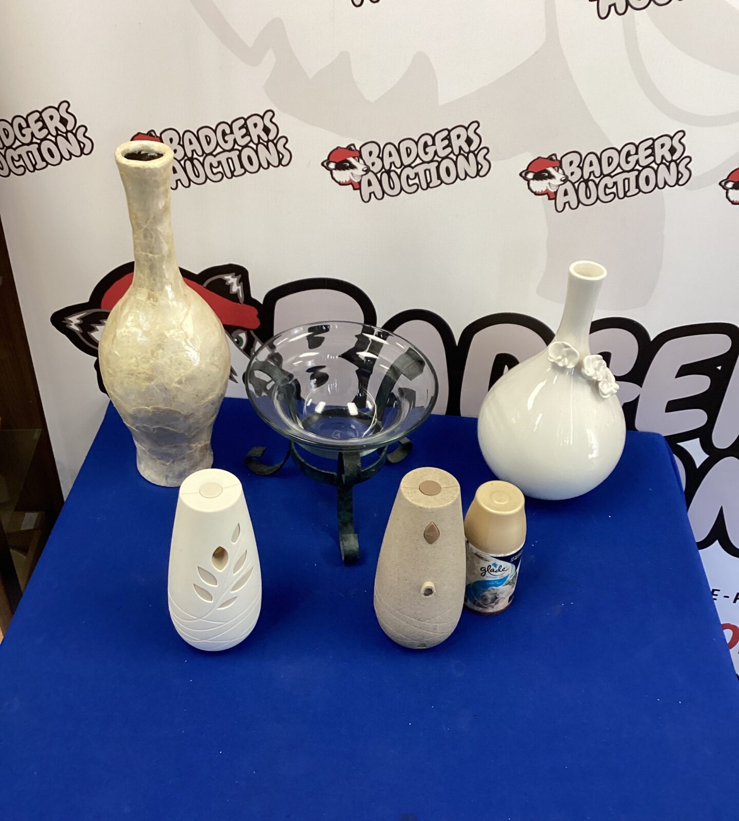 Two tall vases with other items