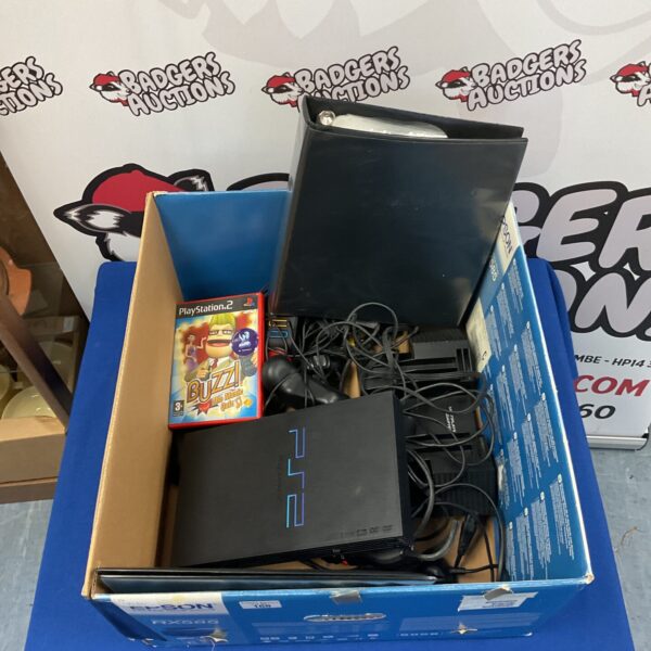 Sony Playstation 2 console with accessories and games