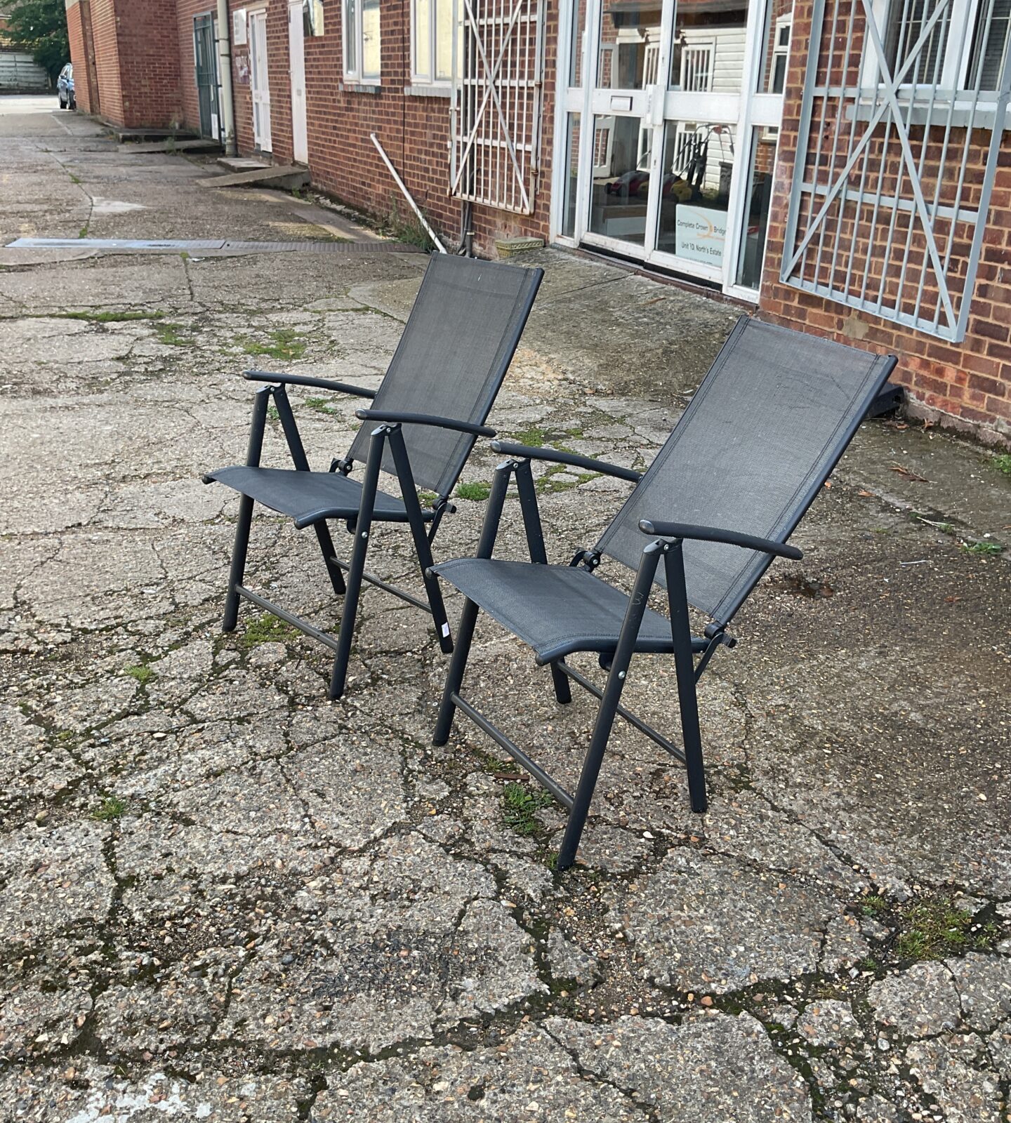 Two folding garden chairs
