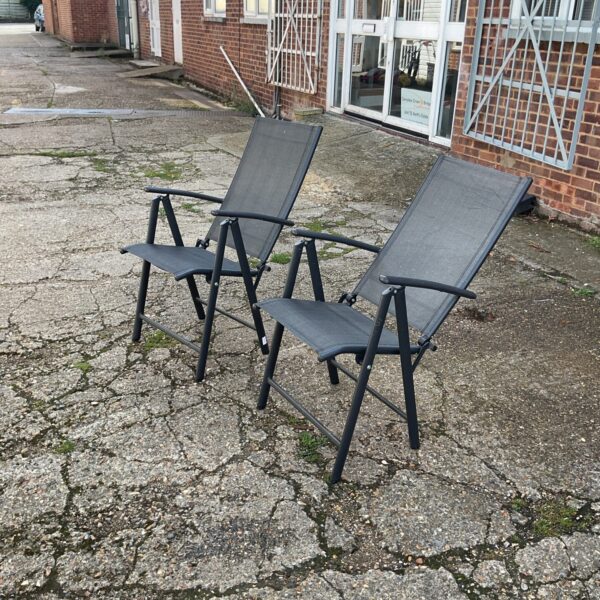 Two folding garden chairs