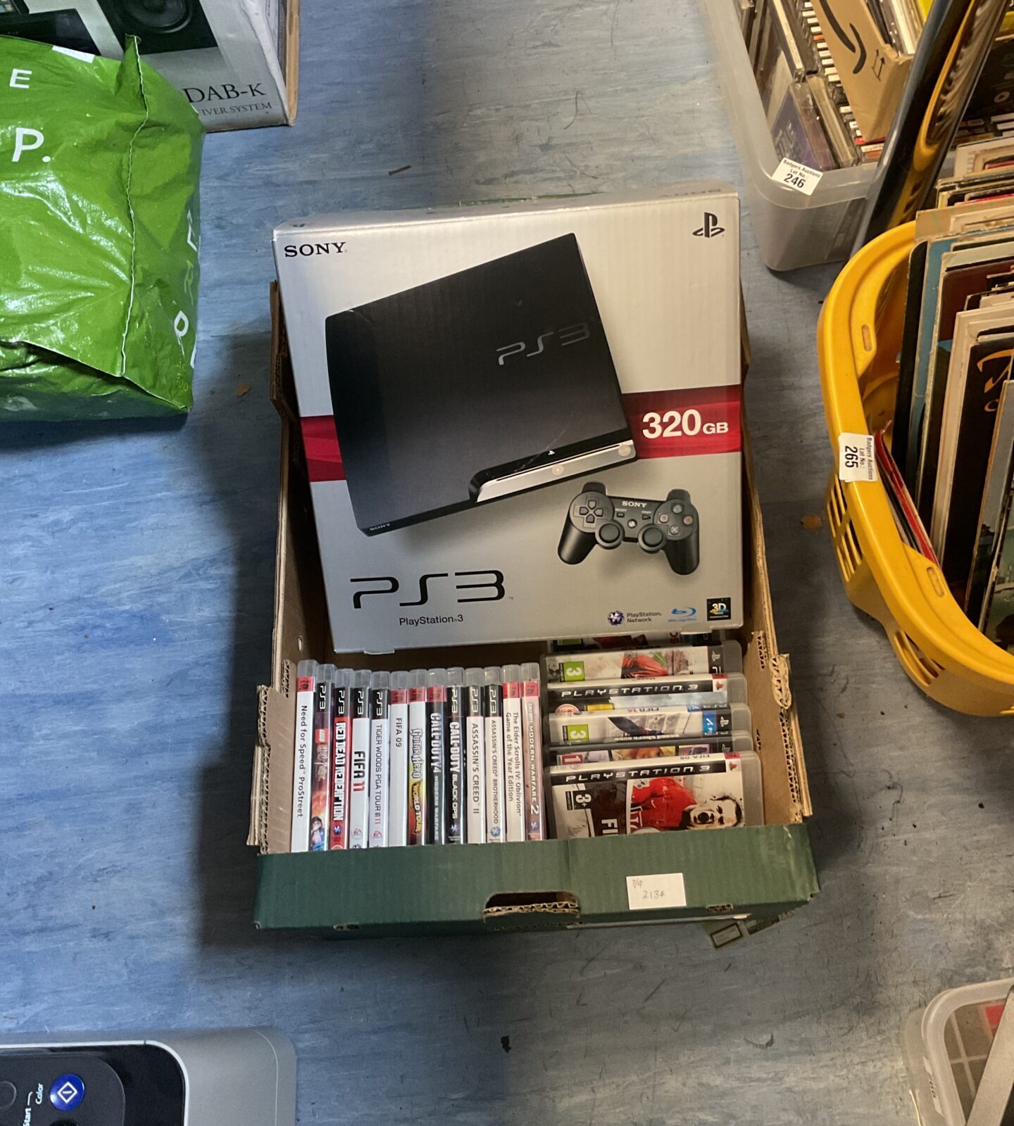 Sony Playstation 3 console with box and assorted collection of games incl. fifa, call of duty, red dead redemption