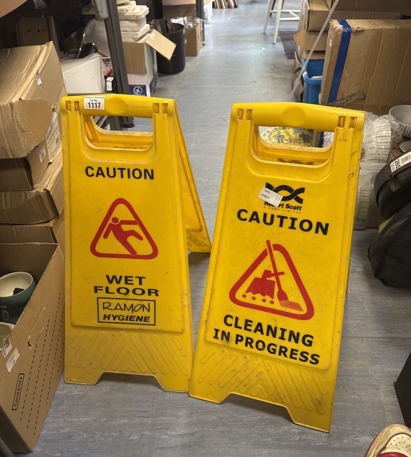 Two wet floor caution signs