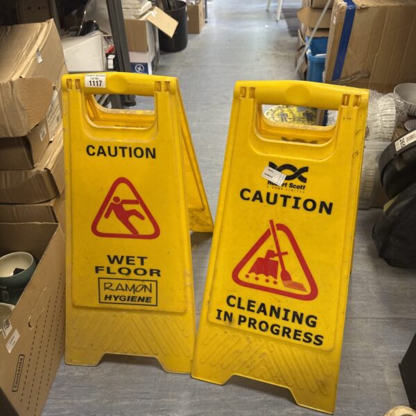Two wet floor caution signs