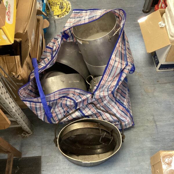 Heavy duty stainless steel catering cooking pots in a blue bag.
