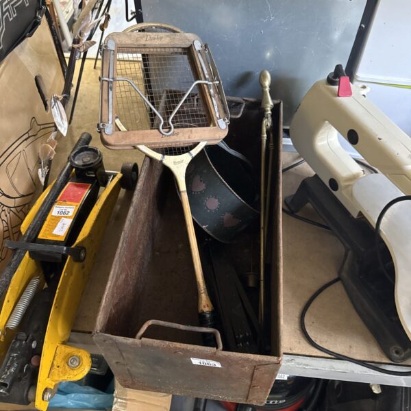 Vintage Pioneer squash racket on a metal tray, collectible sports equipment.