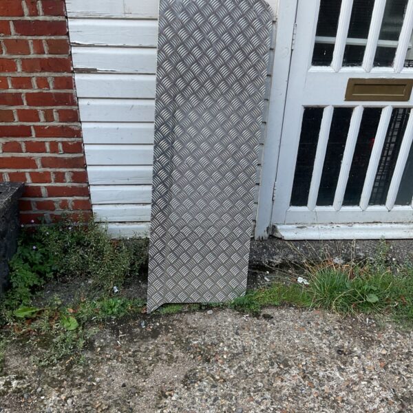 Textured checkerplate metal sheet for industrial or automotive use.