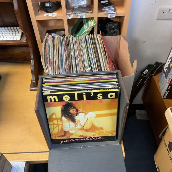 Box of vintage 12 inch vinyl records for collectors.