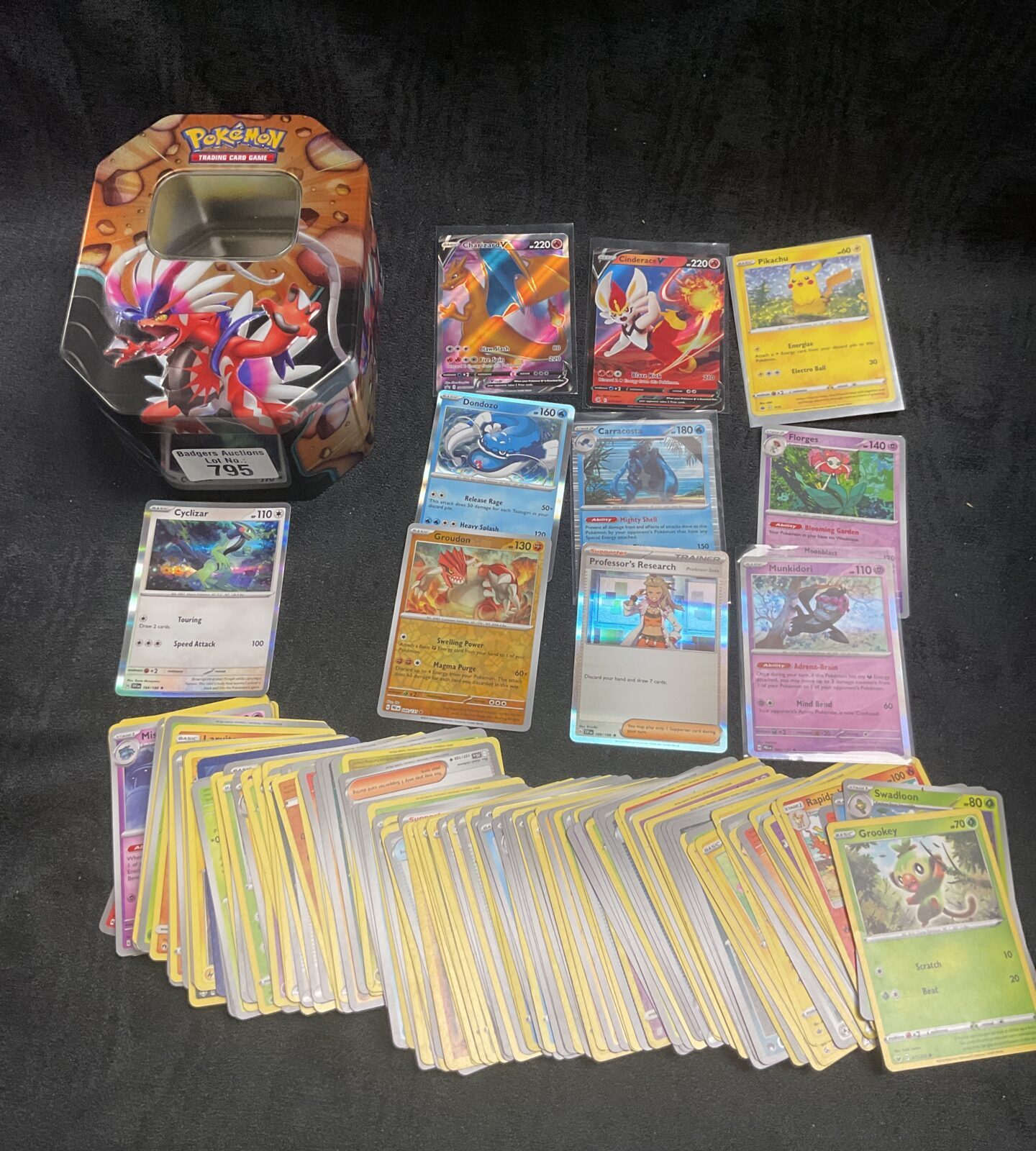 Collection of Pokemon cards in tin