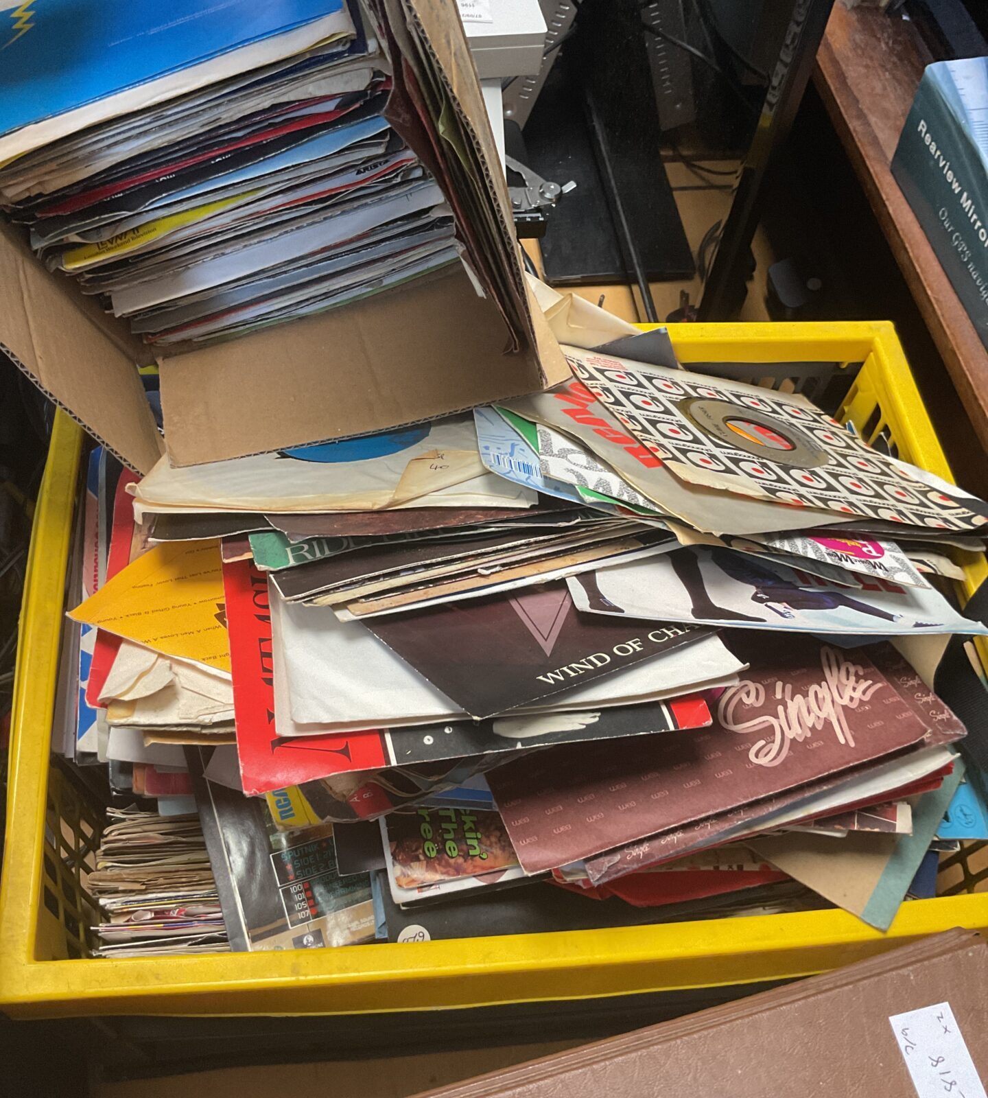 Crate and box of 7” 80’s singles records