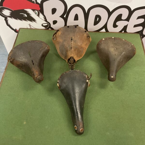 Vintage bicycle saddle lot including Brooks and Leatheries seats.