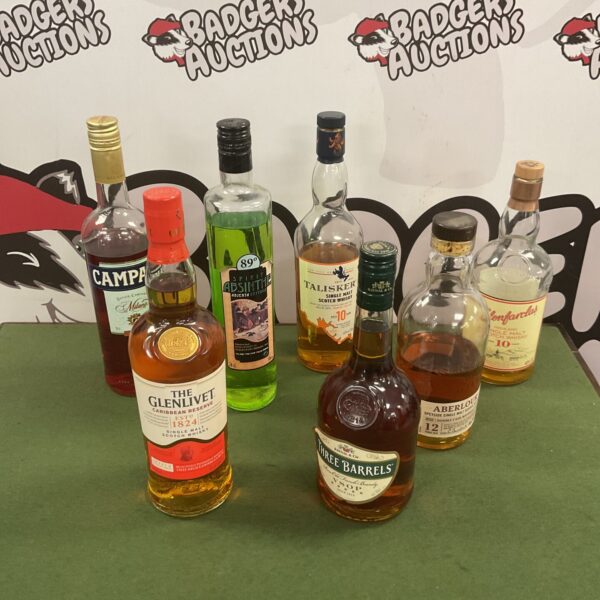 Mixed lot of alcohol bottles including Glenlivet and brandy.