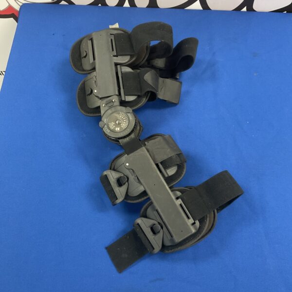 Adjustable flexion extension leg brace for knee support.
