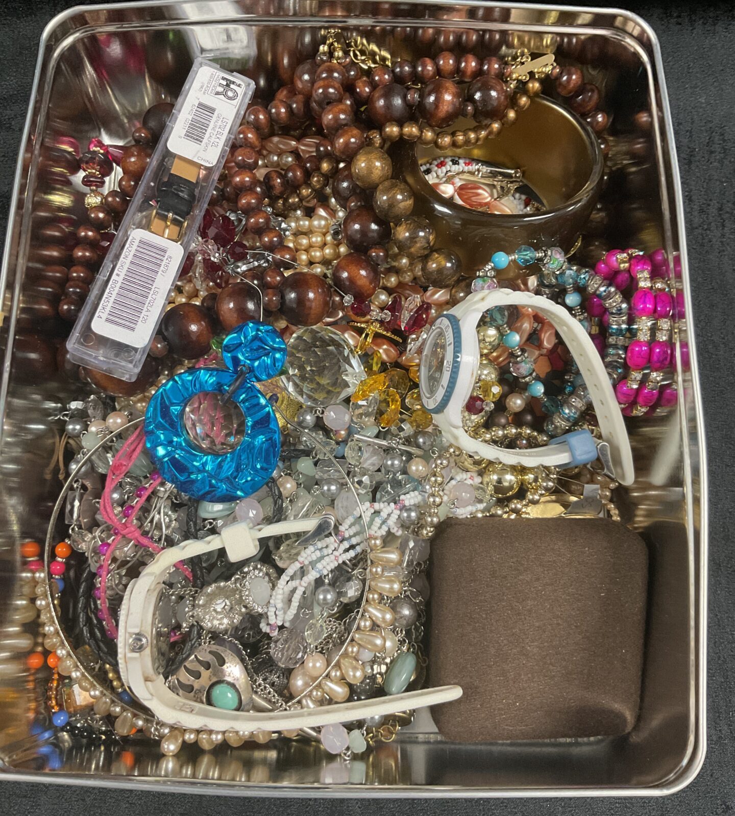 Tin of assorted costume Jewellery