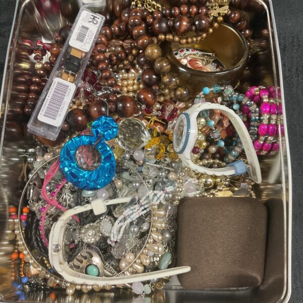 Tin of assorted costume Jewellery