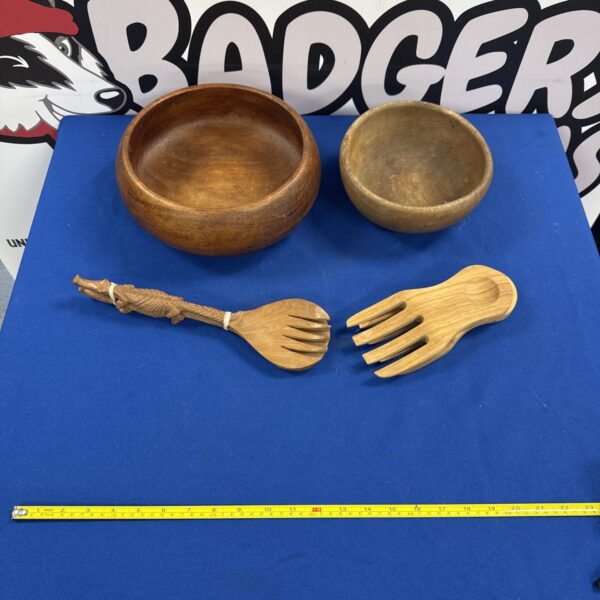 Rustic wooden salad bowls and spoons set for kitchen serving.