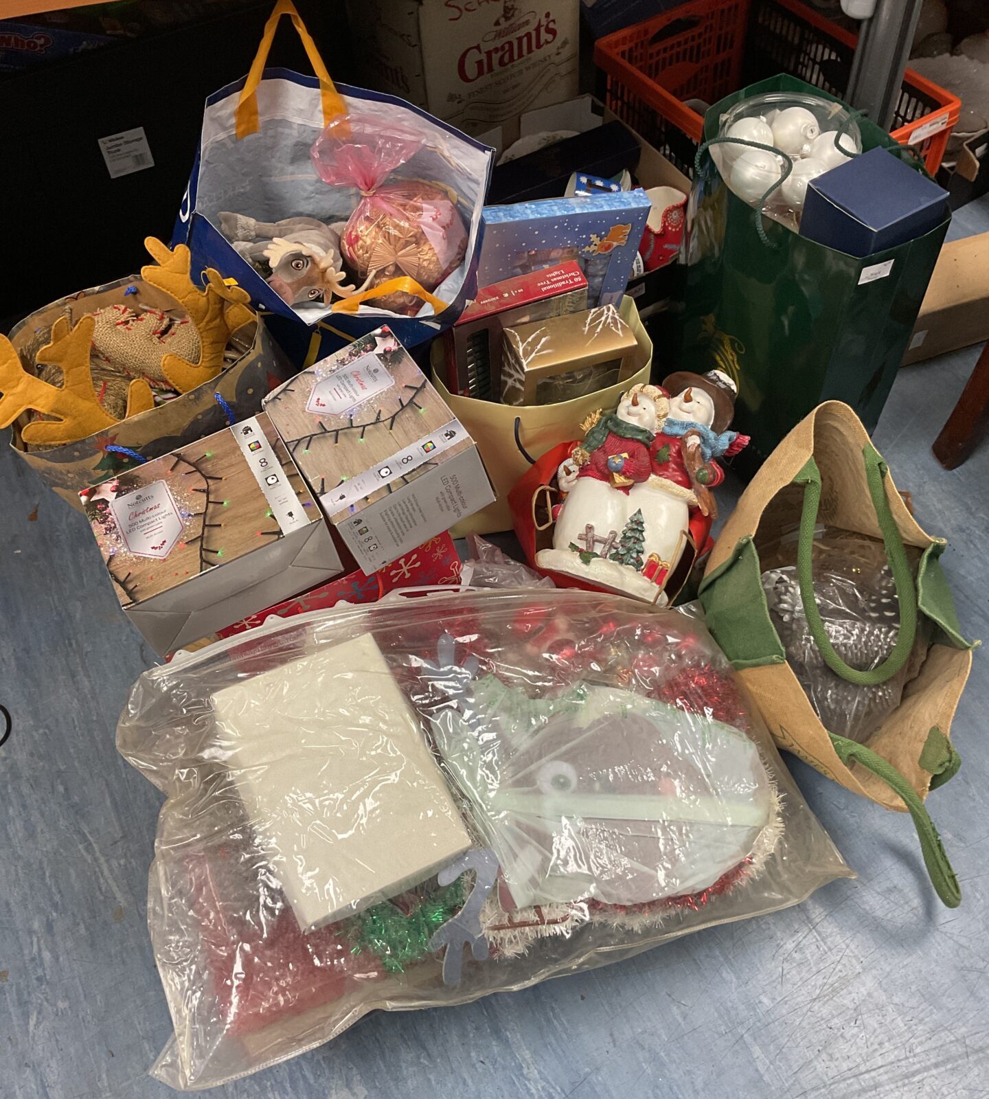 Large lot of Christmas decorations including led lights, baubles, pine cones & ornaments