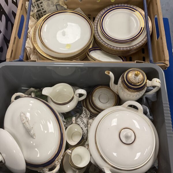 Vintage Royal Doulton and Minton china collection on display.