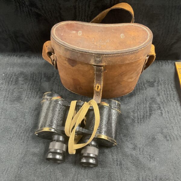 Vintage WW2 artillery binoculars in a leather case.