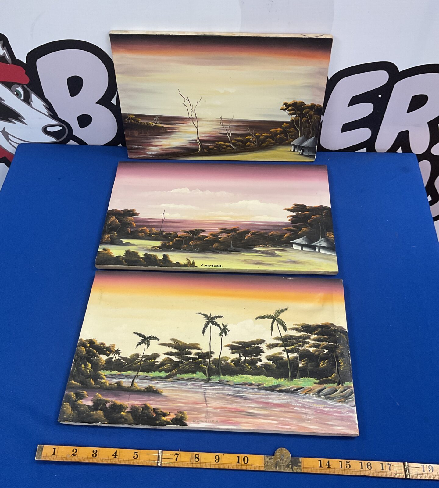 Three African oil paintings of African Evening landscapes signed P Mwaura