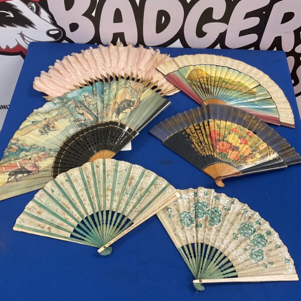 Vintage LNER railway fan with colourful travel illustrations.