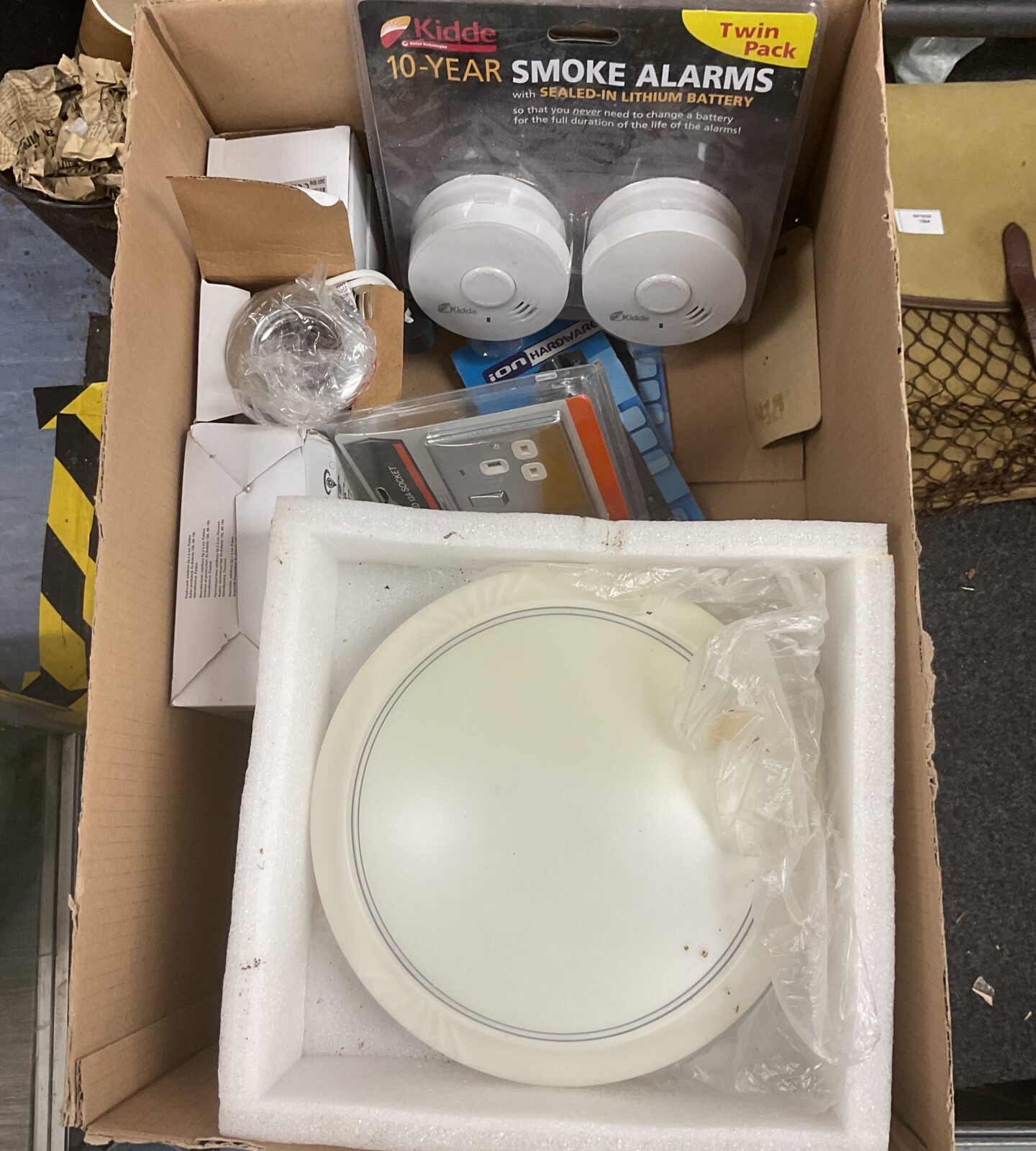 Sealed two-pack of Kidde smoke detectors for home fire safety.