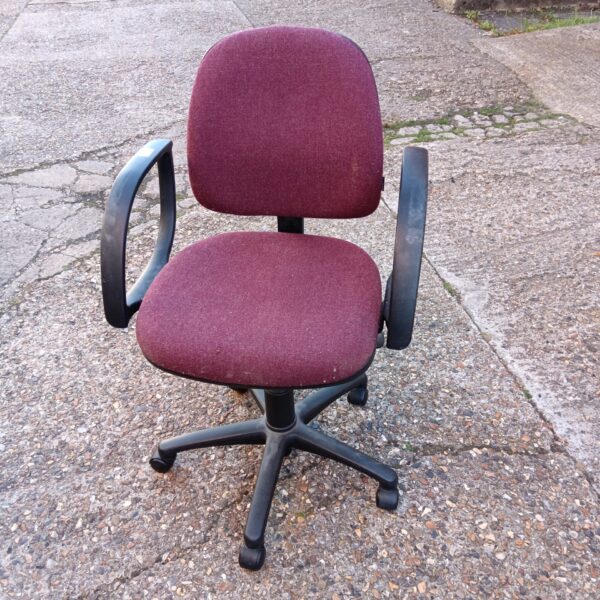 Maroon fabric office chair with swivel base and casters.