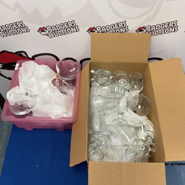 Two boxes filled with a mixed lot of glassware, including cocktail glasses.