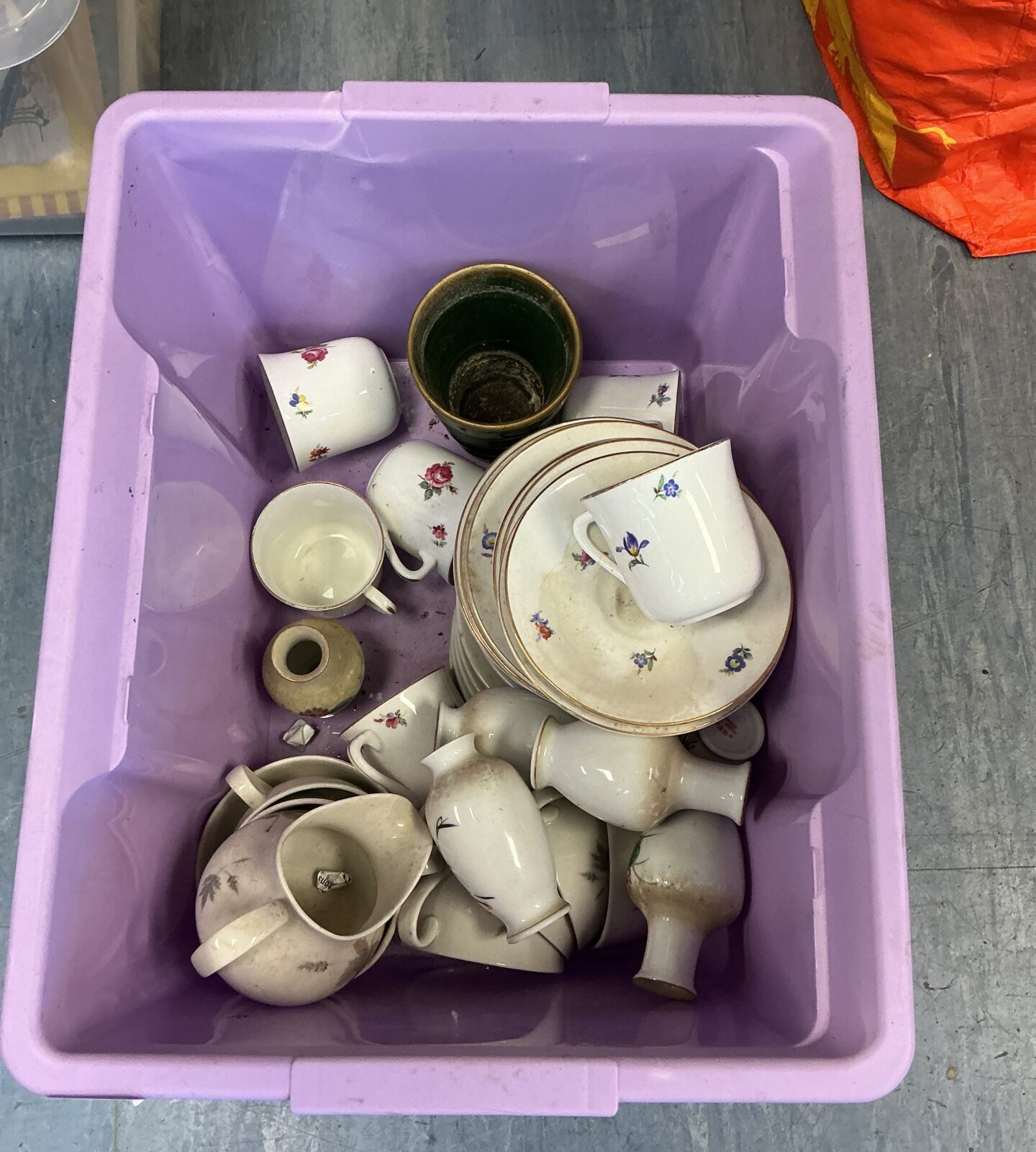 Mixed porcelain tea set with floral patterns, vintage china collection.