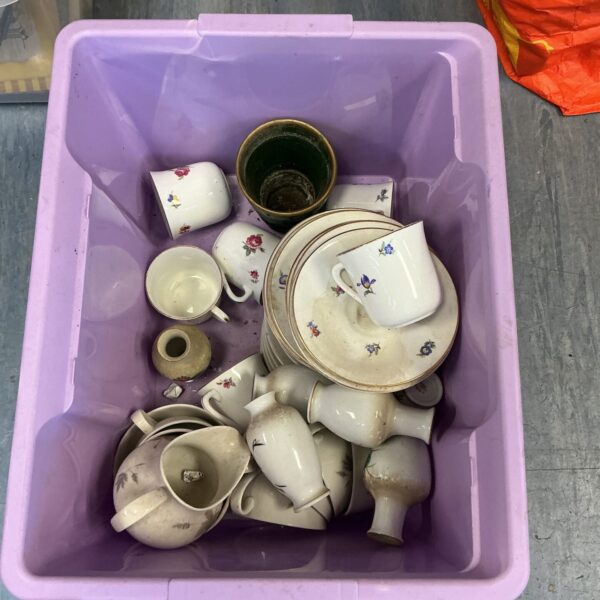 Mixed porcelain tea set with floral patterns, vintage china collection.