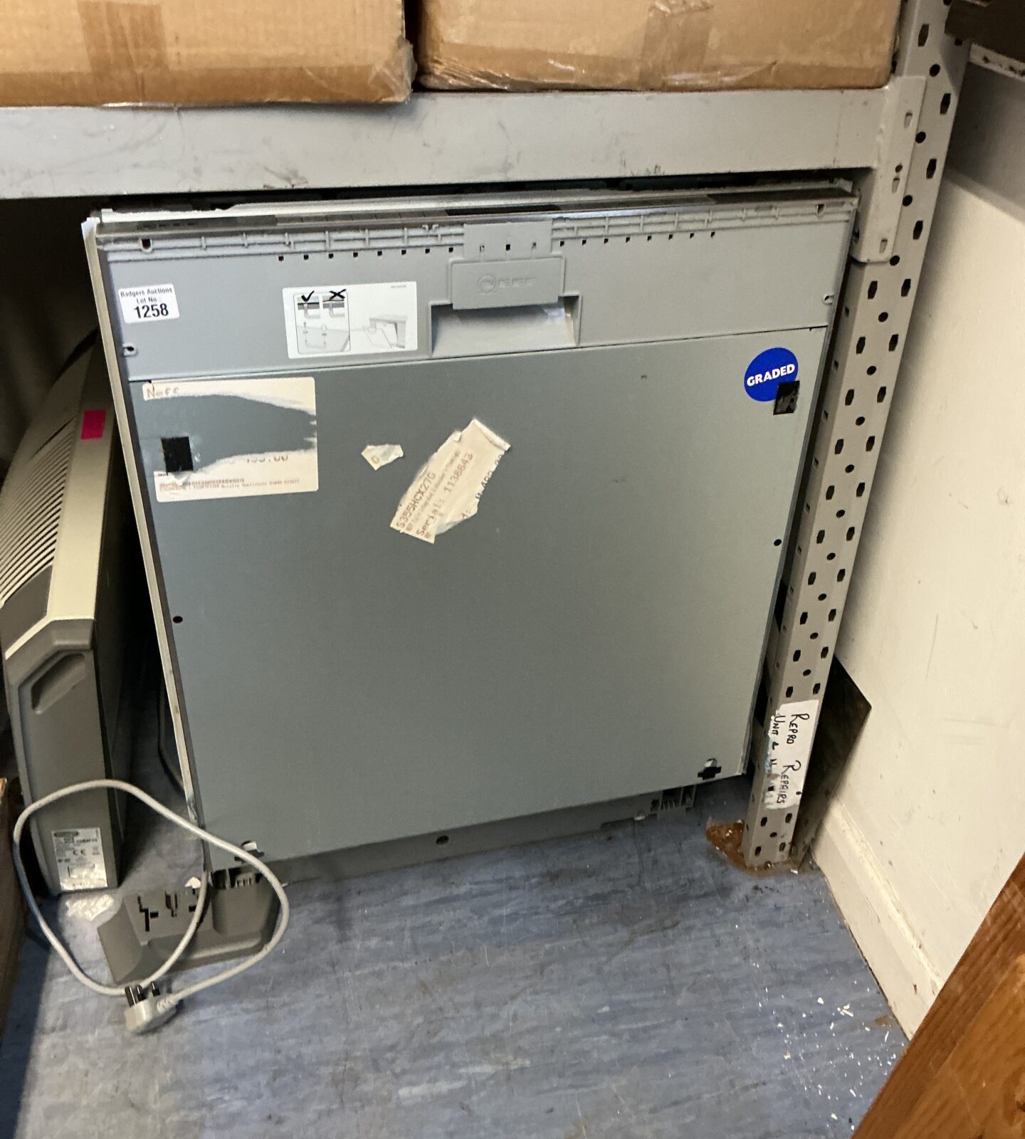 Front view of a vintage NEF integrated dishwasher.