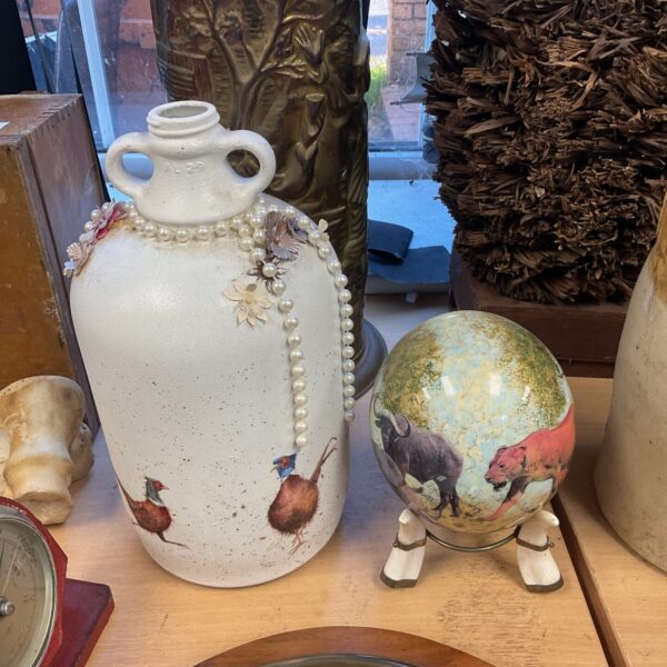 Signed ostrich egg on pedestal with pheasant flagon, collectible art.